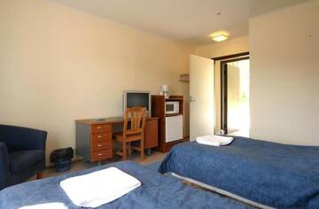 Фото номера Двухместный номер с 2 отдельными кроватями Мотели Motel Patalahti г. Йямся 8