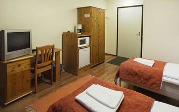 Фото номера Двухместный номер с 2 отдельными кроватями Мотели Motel Patalahti г. Йямся 11
